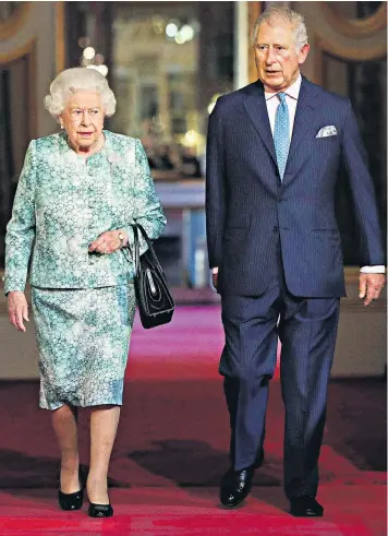  ??  ?? The Queen and the Prince of Wales arriving together to open the 25th Commonweal­th Heads of Government Meeting at Buckingham Palace formally yesterday ahead of a day of speeches, ceremonies and meetings