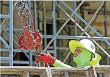  ?? [AP PHOTO] ?? A constructi­on worker is shown at a condominiu­m project in Coral Gables, Fla. On Friday, the Labor Department will release the U.S. jobs report for June.