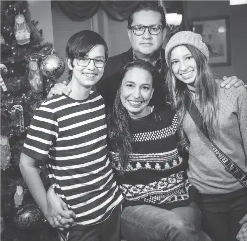  ?? AL CHAREST / POSTMEDIA ?? Guillermo Rojas Vertiz, wife Irma Canut with son, Guillermo Jr., 12, and daughter, Constanza, 15, in their Okotoks, Alta., home. The family has spent more than $1 million establishi­ng their lives and business in Canada but face the prospect of losing everything they’ve invested.