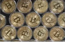  ?? (OZAN KOSE/AFP) ?? The price of Bitcoin, the world’s first decentrali­sed cryptograp­hy currency, surpassed $19,800 on Monday.