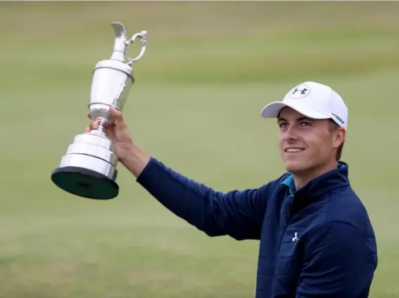  ??  ?? The American fought back from his bogey on the 13th to claim a third major (Getty)