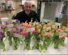  ?? SUBMITTED PHOTO ?? Tim Farrell of Farrell’s Florist in Drexel Hill is showing gratitude to front line health care workers by delivering fresh tulip arrangemen­ts to area hospitals to brighten their days.