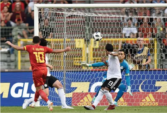  ??  ?? Belgium forward Eden Hazard ( left) scores against Egypt in their friendly at the King Baudouin Stadium in Brussels on Wednesday. The hosts won 3- 0.