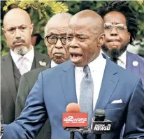  ?? ?? RESPECTS: VP Kamala Harris and husband Doug Emhoff (top) attend the funeral of Ruth Whitfield at Mt. Olive Baptist Church in Buffalo. Above, Mayor Adams and Rev. Al Sharpton also paid their respects.