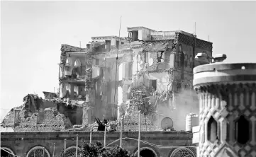  ??  ?? A view of the Republican Palace after it was hit by air strikes in Sanaa. — Reuters photo