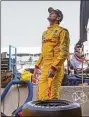  ?? Chris Young / Associated Press ?? Ryan Hunter-Reay stands in the pit area before a practice session in 2014, in Toronto.