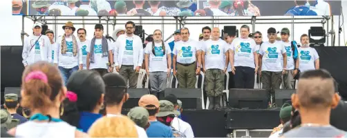  ??  ?? LLANOS DEL YARI, Colombia: Members of the Revolution­ary Armed Forces of Colombia (FARC) secretaria­t attend the opening ceremony of the Sept 17-23 10th National Guerrilla Conference yesterday. — AFP