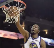  ?? Ben Margot / Associated Press ?? Then-Golden State Warriors’ Kevin Durant scores against the Los Angeles Clippers in a 2019 playoff series in Oakland.