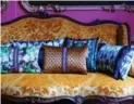  ?? MARISKA MEIJERS ?? Rustic looks are being overtaken by more formal schemes, accented by decorative accessorie­s, such as these colourful pillows.