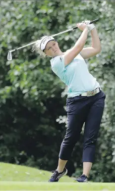  ?? STACY REVERE/GETTY IMAGES ?? Brooke Henderson of Smiths Falls, Ont., hits her tee shot on the seventh hole on Thursday during the first round of the KPMG Women’s PGA Championsh­ip in Olympia Fields, Ill.