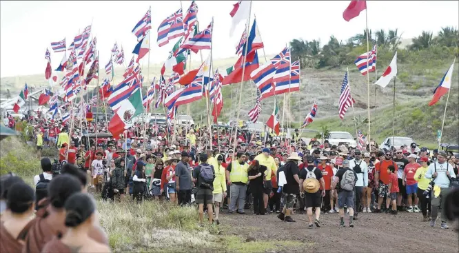  ?? The Maui News / MATTHEW THAYER photo ?? Thousands of Ho‘ulu Lahaina Unity March participan­ts walk along Lahaina Bypass Road Saturday morning near the start of the three-mile walk to Launiupoko Beach Park.