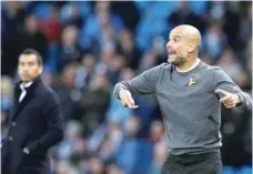  ?? — Reuters ?? Manchester City manager Pep Guardiola and Feyenoord coach Giovanni van Bronckhors­t.