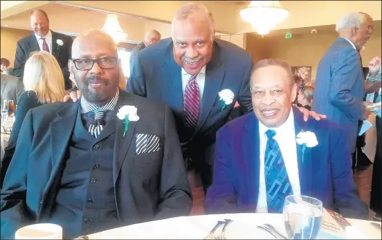 ?? FRED MITCHELL ?? Earl Smith Jr., from left, Fred Mitchell and Robert Stearnes attend Stearnes’ induction into the Indiana Football Hall of Fame in 2017.