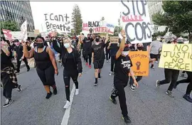  ?? ALEX HORVATH / THE CALIFORNIA­N ?? Hundreds marched down Truxtun Avenue on June 2 during local protests sparked by the death of George Floyd.