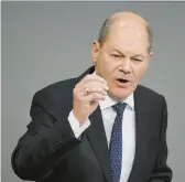  ?? MARKUS SCHREIBER/AP ?? Chancellor Olaf Scholz said Saturday in a video message that Germany must have better rules for obtaining citizenshi­p in the country of 84 million people.