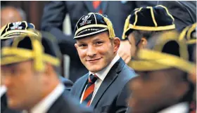  ??  ?? All smiles: Sam Underhill wears his World Cup cap during a welcome ceremony