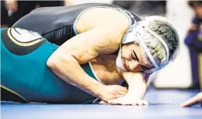  ?? MEG MCLAUGHLIN U-T ?? Granite Hills’ Abram Cline pins Olympian’s Samuel Costa in the 108-pound final Saturday.