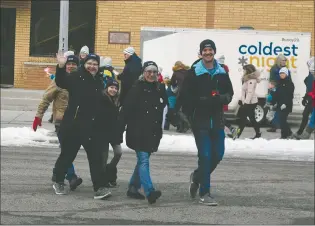  ?? NEWS PHOTO MO CRANKER ?? The Clow Canada team walks at the beginning of the Coldest Night of the Year walking event. The event had roughly 100 walkers and raised close to the $20,000 goal. The event fundraised for the Mustard Seed.