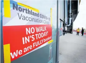  ??  ?? The signs are out — bookings only at Northland’s Covid-19 vaccinatio­n centres — like Whanga¯ rei’s Semenoff Stadium, above. But some Northlande­rs are finding it hard to get an appointmen­t.