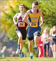  ?? SEAN D. ELLIOT/THE DAY ?? Woodstock Academy’s Ethan Aspiras outraces East Lyme’s Luke Anthony to the finish to win individual honors during Monday’s ECC boys’ cross country championsh­ip at the Norwich Golf Course. East Lyme won its thrid straight team title.