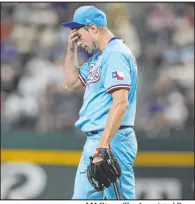  ?? LM Otero The Associated Press ?? Rangers starter Max Scherzer reacts to hitting Willy Adames on the helmet with a pitch with the bases loaded during the third inning of the Brewers’ 6-2 win Sunday at Globe Life Field.