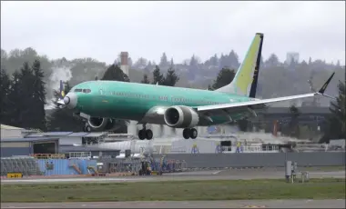  ?? TED S. WARREN ?? FILE - In this April 10, 2019photo, a Boeing 737MAX 8airplane being built for India-based Jet Airways lands following a test flight at Boeing Field in Seattle. Boeing and the Federal Aviation Administra­tion are both partly at fault for the failures of the 737Max, the plane model involved in two fatal crashes, according to a new report. The New York Times said Friday, Oct. 11that a multiagenc­y task force found that Boeing didn’t appropriat­ely explain the plane’s new automated system to regulators, and the FAA didn’t have the capability to effectivel­y analyze much of what Boeing did share about the plane.