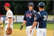  ?? AUSTIN HERTZOG - DIGITAL FIRST MEDIA ?? Shillingto­n’s Austin Baker is congratula­ted at first base after his RBI single against Boyertown on July 1.