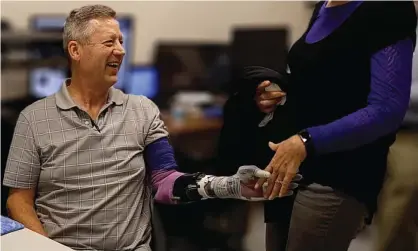  ??  ?? Keven Walgamott using his prosethic arm to shake a researcher’s hand. Photograph: Courtesy University of Utah Center for Neural Interfaces