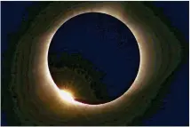  ?? ANTHONY SOUFFLE / STAR TRIBUNE ?? The moon blots out the sun Monday in a total solar eclipse as seen from Farmington, Mo. Stargazers in the Austin area saw only a partial solar eclipse.