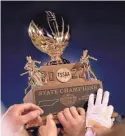  ?? HELEN COMER/THE DAILY NEWS JOURNAL ?? Friendship Christian players lift up their trophy after beating Nashville Christian in the 2022 Bluecross Bowl.