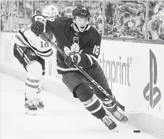  ?? TORONTO STAR FILE PHOTO ?? Toronto Maple Leafs winger Andreas Johnsson works the side boards to control the puck in front of Dallas entre Tyler Pitlick earlier this month. Johnsson’s developmen­t with the Marlies is paying off for the Leafs.