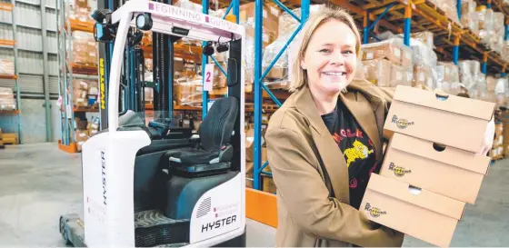  ?? ?? Fashion retailer Sarah Timmerman at the Brisbane warehouse of Beginning Boutique. Picture: Richard Walker