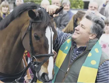  ?? Picture: Getty ?? Paul Nicholls with Kauto Star after the steeplecha­ser’s fifth win in the King George in 2011