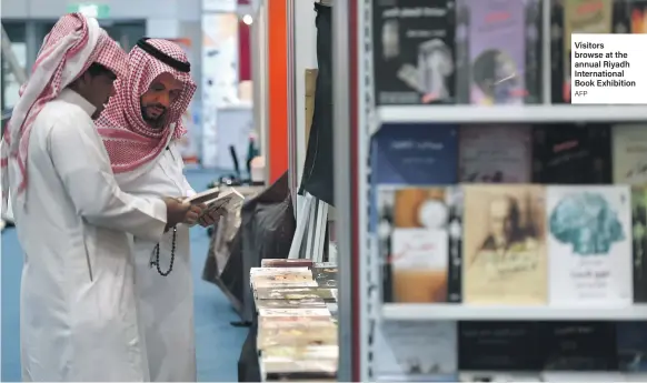  ?? AFP ?? Visitors browse at the annual Riyadh Internatio­nal Book Exhibition