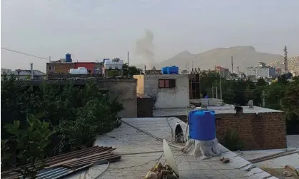  ?? Photograph: AFP/Getty Images ?? Smoke rises from a house after a US drone strike in the Sherpur area of Kabul, on Sunday.