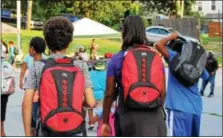  ?? DIGITAL FIRST MEDIA FILE PHOTO ?? Children receive free backpacks filled with school supplies at a community event in Pottstown. As students and parents get back into a school routine, it’s important that children consume necessary nutrients for proper growth and function.