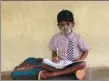  ?? MAHESH KUMAR A. / AP ?? A student attends a class on the first day of the partial reopening of government schools in Hyderabad, India, on Sept 1.