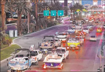  ?? Chitose Suzuki Las Vegas Review-journal @chitosepho­to ?? A parade of boats takes place Friday on the Strip as enthusiast­s protest the possible closure of boating ramps at Lake Mead National Recreation Area.