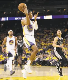  ?? Scott Strazzante / The Chronicle ?? Patrick McCaw flips a pass during Game 2 of the Western Conference finals, in which he scored 18 points.