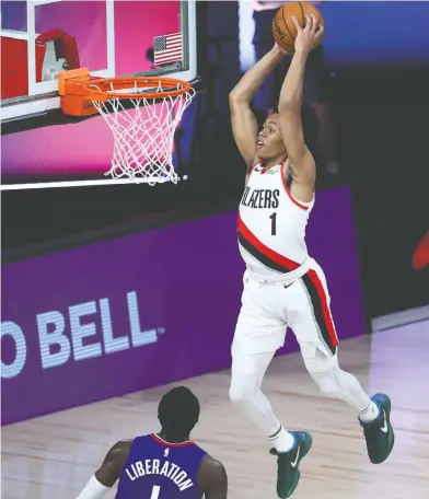  ?? KIM KLEMENT / POOL PHOTO VIA AP FILES ?? Portland's Anfernee Simons, dunking in a game last year, has stiff competitio­n in Obi Toppin and Cassius Stanley.