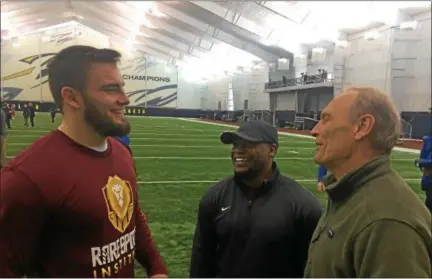  ?? JOHN KAMPF — THE NEWS-HERALD. ?? John Stepec, former standout for the Lake Catholic and University of Toledo football programs, talks with his agent Sherman Ledet and father Tom Stepec after Toledo’s Pro Day on March 20.