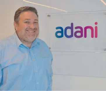  ?? ECONOMIC LIFT: Adani Mining CEO Lucas Dow in the company's Townsville office. ??