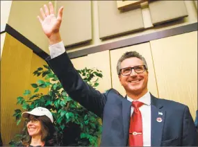  ?? Mark Mirko / Hartford Courant via AP ?? Manny Santos waves during the Connecticu­t Republican Party’s convention in Mashantuck­et. Santos won the 5th congressio­nal district nomination in the Aug. 14 Republican primary. He will face Democrat Jahana Hayes in the November general election.