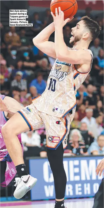  ?? Picture: Dave Rowland/Getty ?? Ben Ayre aims a basket during a Taipans game at Spark Arena in January.