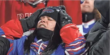  ?? TINA MACINTYRE-YEE/ROCHESTER DEMOCRAT AND CHRONICLE ?? A fan reacts during the second half of the Buffalo Bills’ divisional game against Kansas City Chiefs at Highmark Stadium in Orchard Park on Jan. 21.