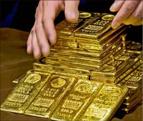  ?? Associated Press ?? Gold has historical­ly been a safe-haven asset for investors.