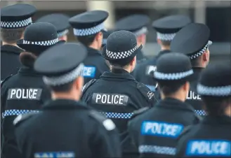  ??  ?? HOLDING THE LINE: Recruits participat­e in a passing-out parade at Tulliallan Police College. The way they – and indeed civilian employees – are directed by the Police Scotland high command is coming under scrutiny.