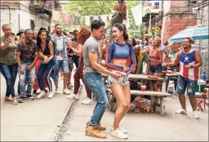  ?? Macall Polay / TNS ?? Anthony Ramos, left, and Melissa Barrera in Jon M. Chu’s “In the Heights,” based on Lin-Manuel Miranda’s hit Broadway musical.