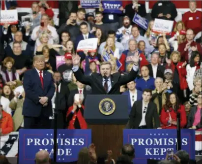  ?? ASSOCIATED PRESS ?? Republican Rick Saccone, right, acknowledg­es the crowd during a campaign rally with President Donald Trump last Saturday in Moon Township, Pa. Saccone faced off against Democrat Conor Lamb in a special election Tuesday for the Pennsylvan­ia 18th...