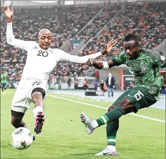  ?? ?? Super Eagles Moses Simon (right) and Bafana Bafana’s Khuliso Mudau battling it out during the Nigeria versus South Africa AFCON 2023 semi final clash in Bouake, Côte d’Ivoire on Wednesday night